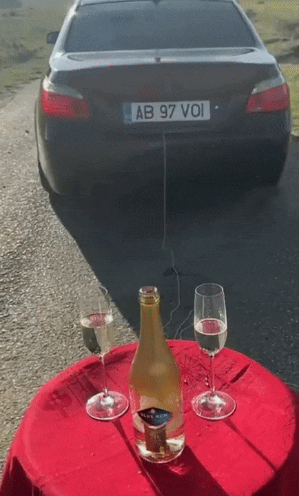 Animated Gif showing: How To Pull Off Table Cloth With A Car - Magic Trick