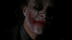 Animated Gif showing: Batman Surprises Joker And Knock His Head Against Table - Scene From Batman: The Dark Knight (2008) Movie